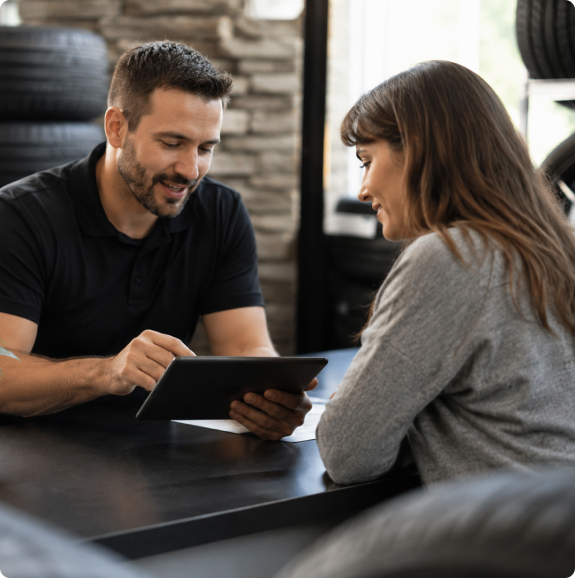A customer being helped with a tire application